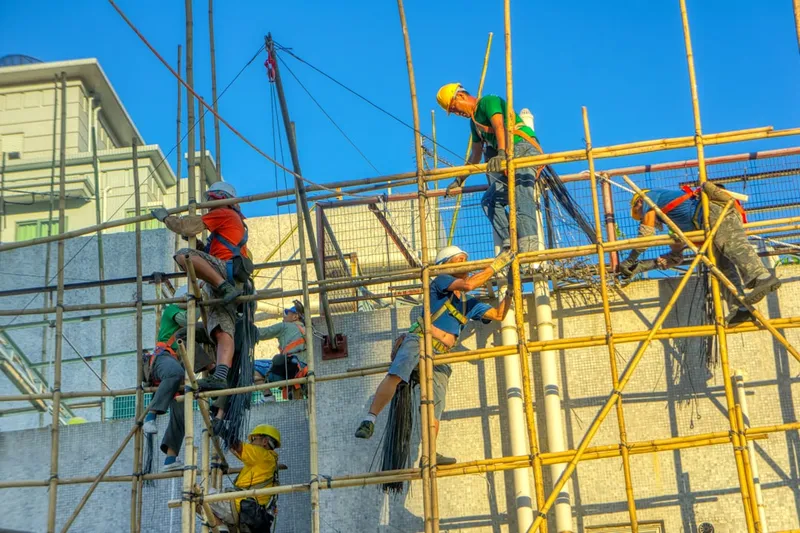 A group of construction workers working on a building